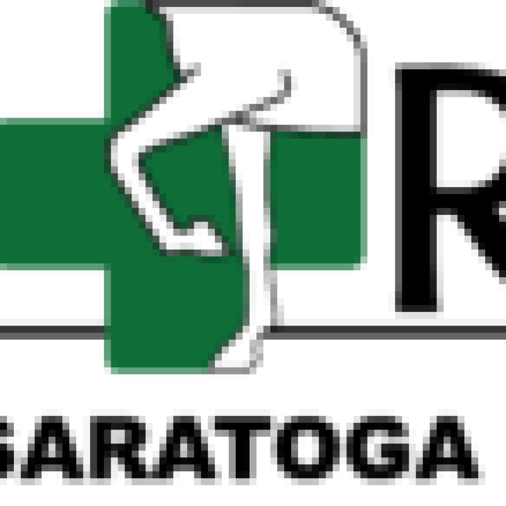 A person standing on the side of a green cross.